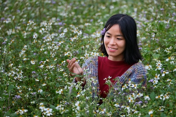 a girl among flowers